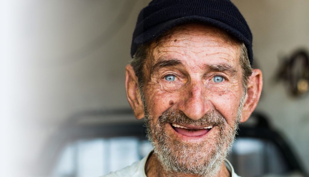 Older man smiling at camera